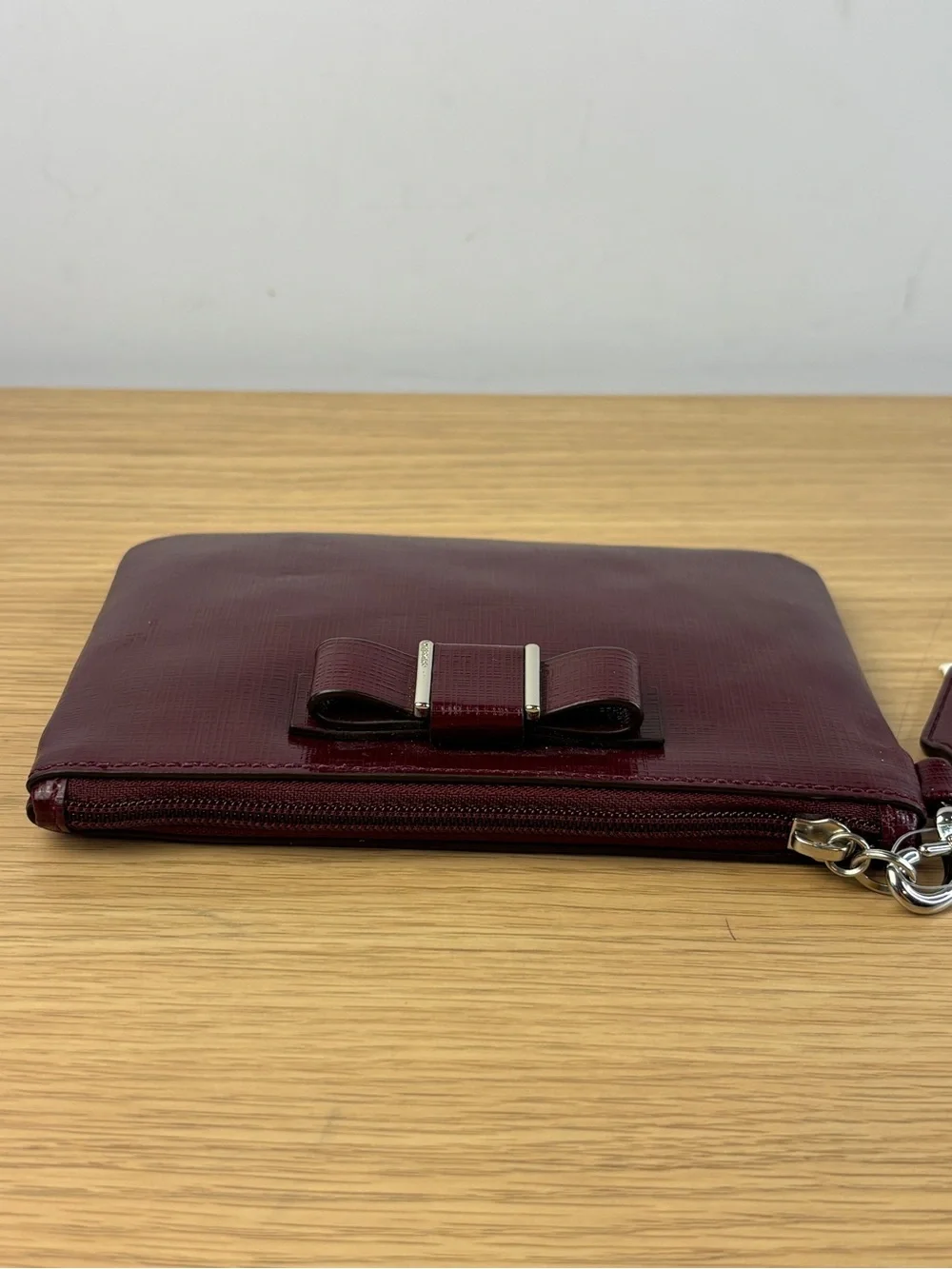 Coach Darcy Patent Leather Bow Small Wristlet in “Sherry” Wine Color NWT